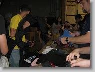 10:31pm - Youth group sorts coats by size. They are all very tired but work very hard.